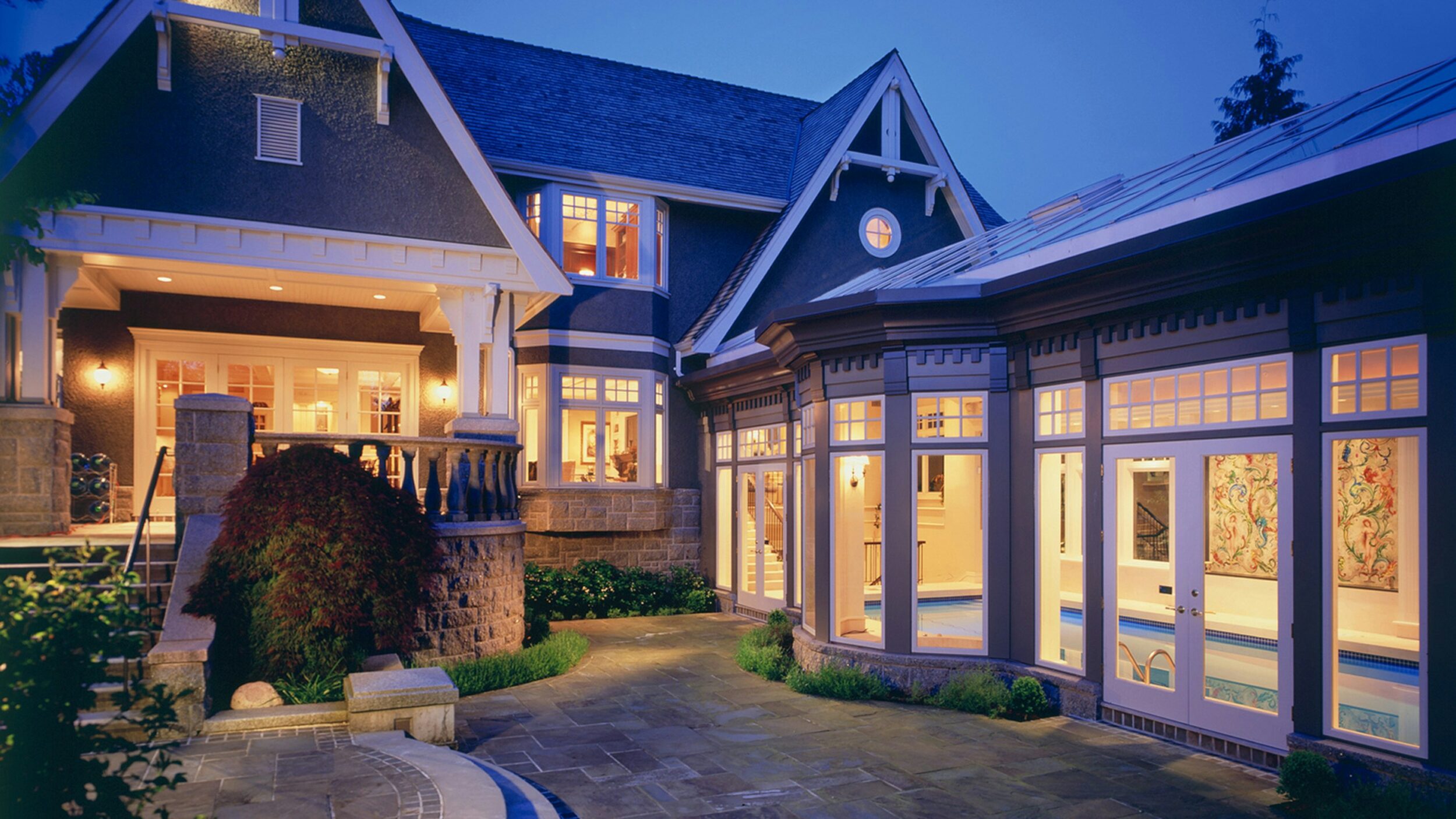 Exterior shot of a craftsman-style home exterior with landscaping. Image credit ashley harris on Unsplash.