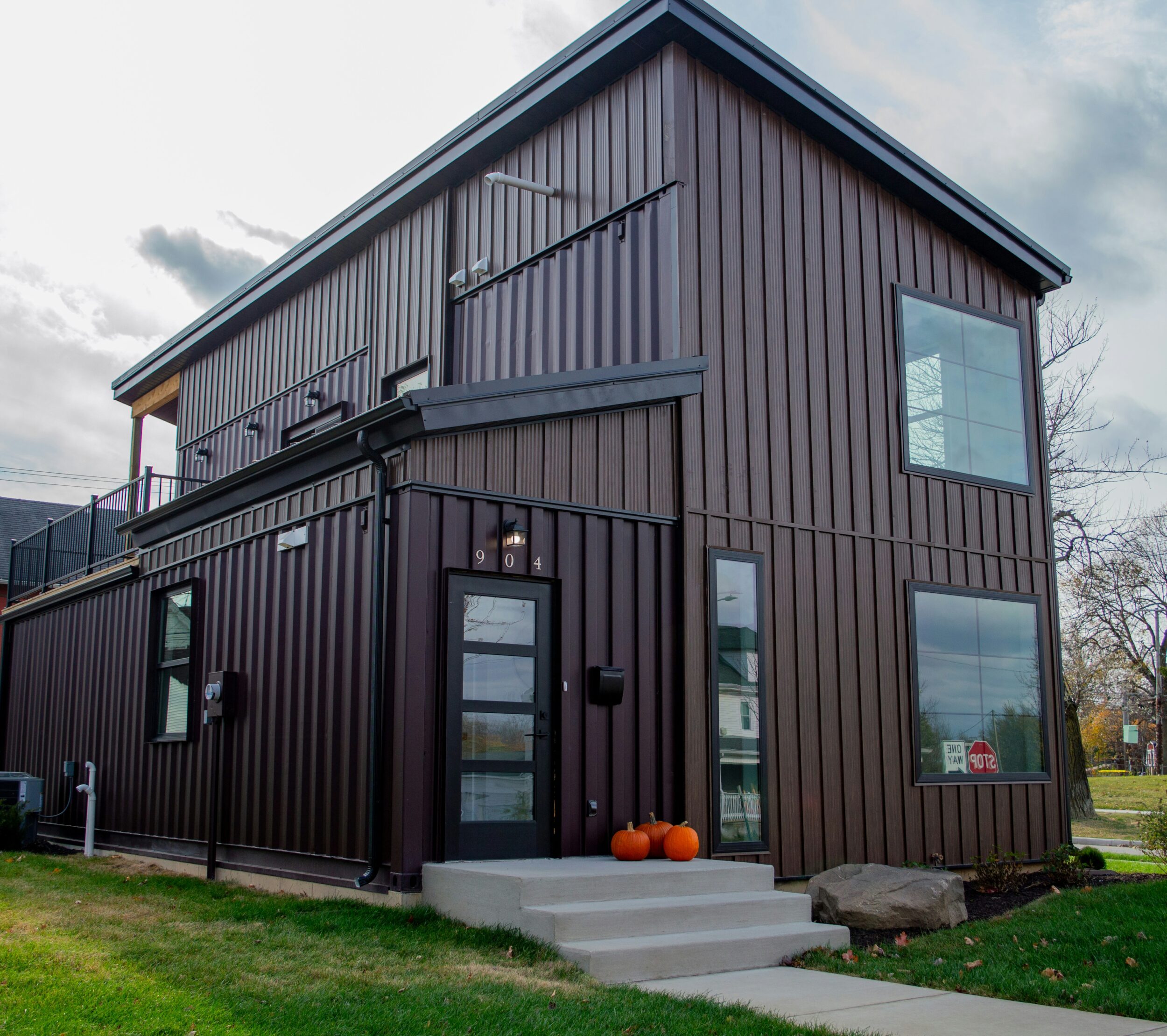 Exterior of a shipping container home, an example of industrial style architecture. Image credit Jubbar J. on Unsplash.